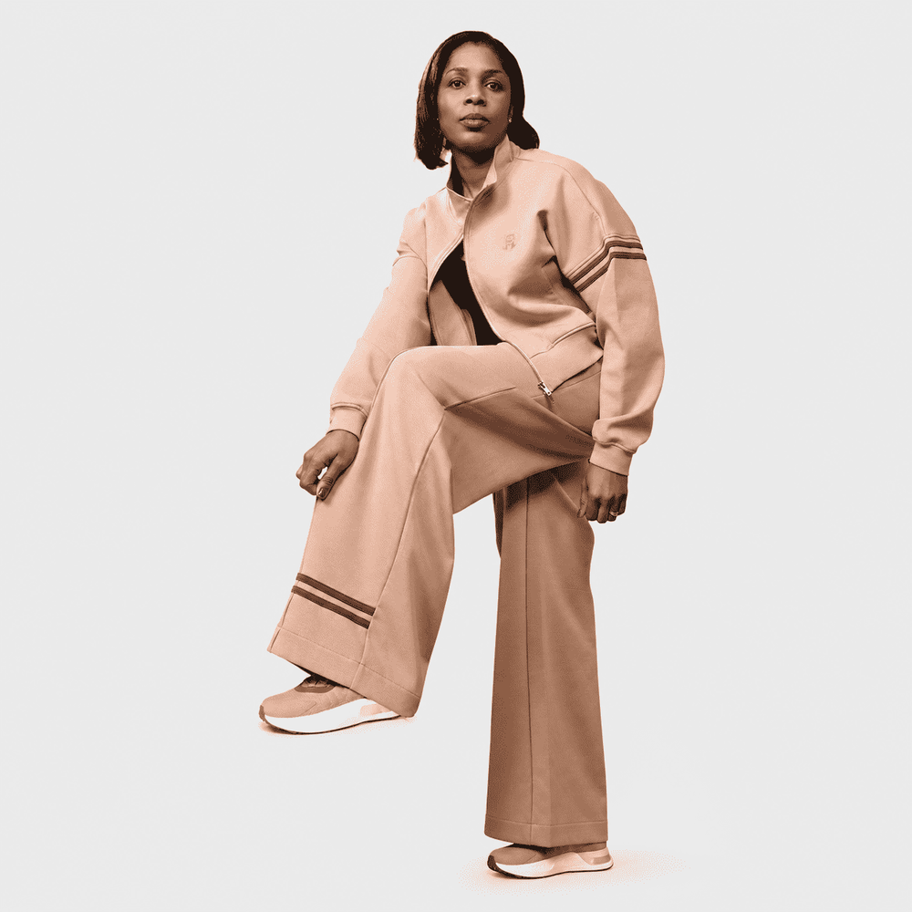 Woman modeling sand beige cropped tracksuit jacket and wide-leg sweatpants set