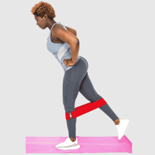 Woman doing lateral band walk with Elyo loop resistance bands for glutes