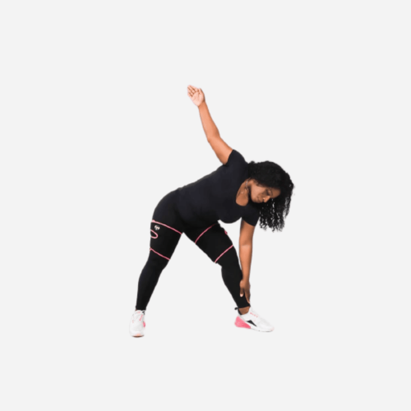 Side stretch pose showing seamless fit of Fit Frances high-waisted compression leggings